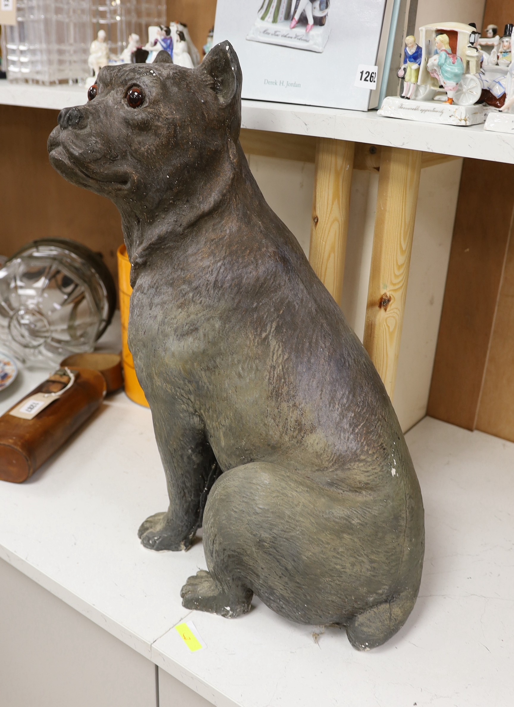 A large painted plaster model of a seated mastiff. 54cm tall